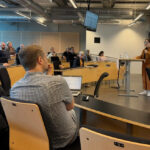 UNC Charlotte team promotes AI literacy in STEM education at Malmö University, showcases Niner Ghost Bus and encourages voting