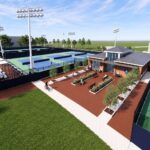 A modern tennis facility featuring multiple courts, a central building with seating areas, and surrounding greenery under a clear sky.